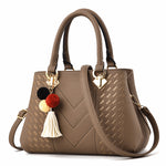 Interior view of a luxury women's handbag with multiple compartments