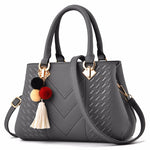 Women's handbag with convenient mobile phone pocket