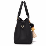 Back view of a stylish women's luxury handbag