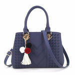 Side view of a women's PU leather fashion handbag